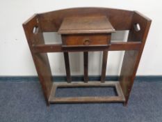 An oak Arts and Crafts hall stand fitted a drawer