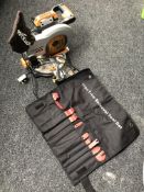 An Evolution circular saw together a part trim removal tool set.