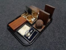 A tray containing a pair of Edwardian bookends, cased silver plated baby push with spoon,
