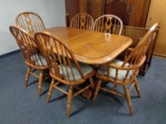 An eight piece Colonial style dining room suite comprising of display cabinet fitted with drawers
