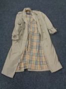 A gents Burberry three quarter length overcoat.
