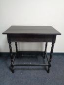 An Edwardian oak occasional table