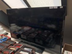 A Polaroid 40'' LCD TV with remote.