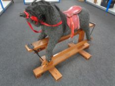 A Pegasus Toys rocking horse.