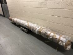 A large roll of un-used Rimini Aged Oak vinyl floor covering,