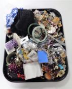 A tray containing a large quantity of assorted costume jewellery.