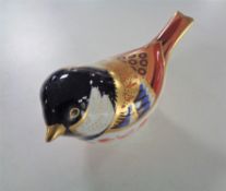 A Royal Crown Derby bird paperweight with gold stopper.