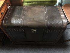A faux leather dome topped trunk fitted two drawers