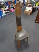 An oak leather seated spinning chair