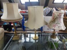 A brass Corinthian column table lamp with shade,