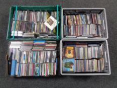 Three boxes containing assorted CDs.