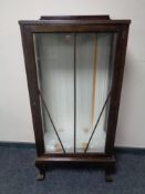 A twentieth century display cabinet on claw and ball feet