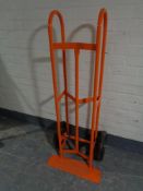 A heavy duty twin handled sack barrow with spring axle