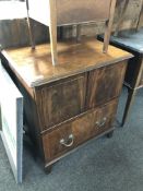 A Victorian inlaid mahogany commode chest