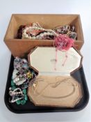 A tray containing a large quantity of assorted costume jewellery.