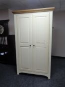 A contemporary cream double door hanging wardrobe
