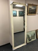 A 5' by 2' swept ivory mirror