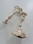 A pair of antique silver candlesticks (A/f), approx 720g.