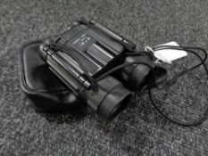A pair of 8 x 21 field binoculars in carry case