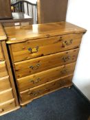 A pine four drawer chest with metal drop handles