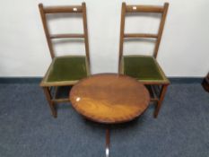 A pair of Edwardian bedroom chairs together with an oval mahogany wine table on three-way pedestal