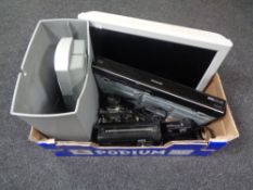 A box containing Panasonic TV and Panasonic DVD player with remotes, cameras, Pure digital radio,