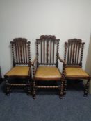An Edwardian oak barley twist rail backed armchair together with two further dining chairs (a/f)