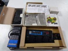 A tray of Zoom 1010 guitar effects processor, Zoom 606 guitar processor, guitar pedals,