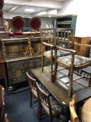A carved oak buffet back sideboard on bulbous legs together with matching extending dining table