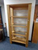 A set of contemporary oak four tier open shelves
