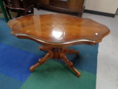 A shaped Italianate glass topped pedestal coffee table