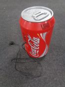 A Coca Cola cooler in the form of a can