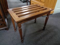 An early twentieth century mahogany luggage stand