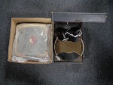 A vintage HMV table top gramophone together with a box of 78's