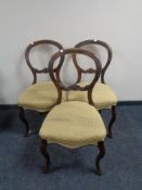 A set of three Victorian mahogany balloon backed chairs