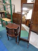 A contemporary shaped jewellery / vanity chest on raised Queen Anne style legs together with a