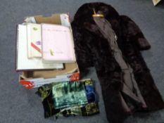 A box of boxed vintage table linens,