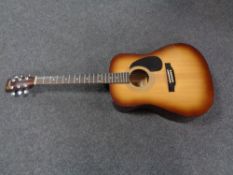 An Encore acoustic guitar.