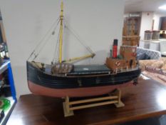 A wooden model of the Isle of Aran, trawler on stand.