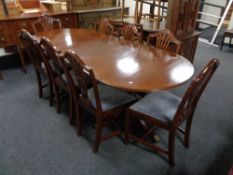 A ten piece mahogany Regency style dining room suite comprising of serpentine sideboard,