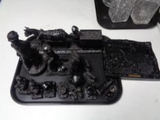 A tray containing coal figures, miners.