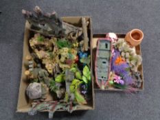 Two boxes containing a quantity of fish tank ornaments.