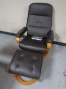 A Himolla brown leather adjustable armchair with matching footstool