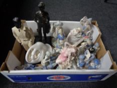 A box containing contemporary figurines,