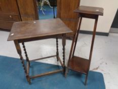 An Edwardian oak barley twist table together with a plant stand
