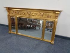 A Regency style gilt overmantel mirror, 141 x 74 x 10 cm.