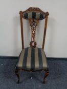 An Edwardian beech high backed occasional chair