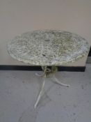 Two cast metal circular patio tables