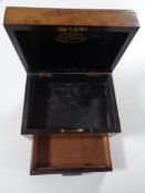 A 19th century walnut homeopathic chemist's box by Davies & Company,