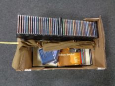 A box containing Jazz Greats CD's and magazines together with a two-piece fishing rod